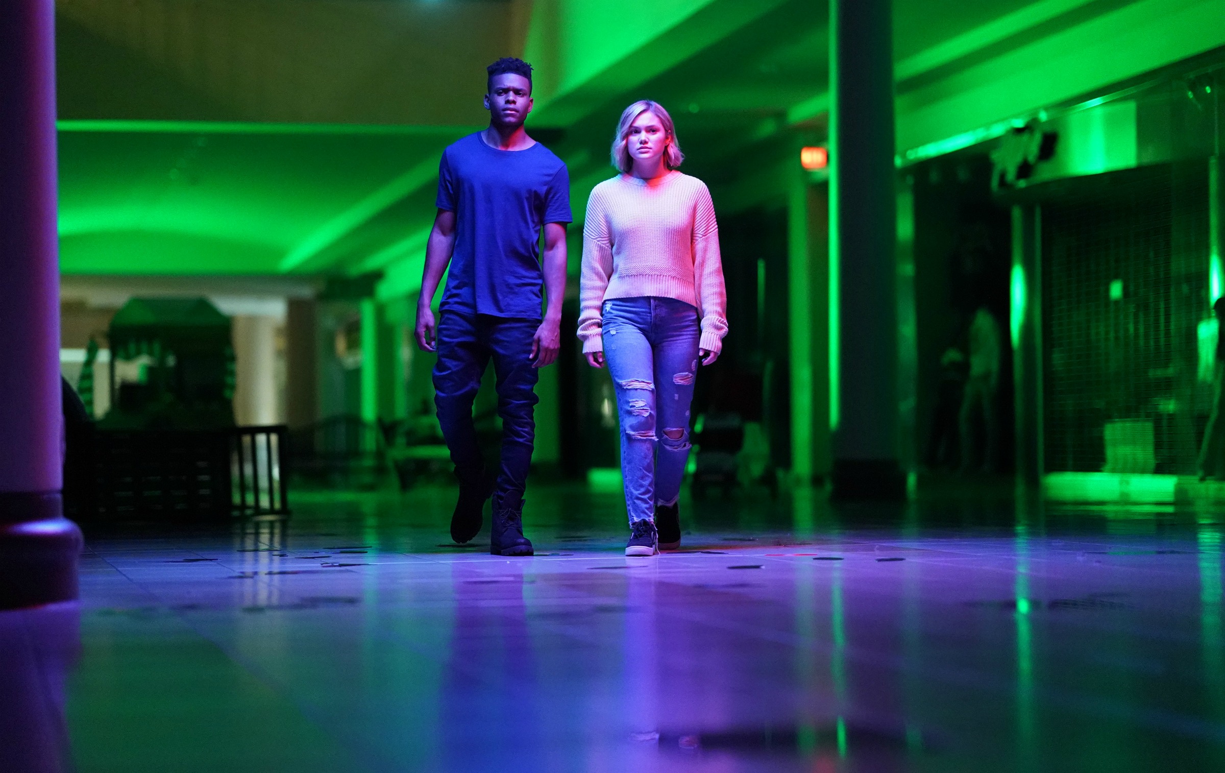 Tyrone and Tandy walk through the eerily light hallway of the "mall" inside the Darkforce Dimension.
